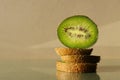 Kiwi sliced with peel on glass. Monochrome brown poster with bright green accent of cut tropical fruit. Horizontal banner with Royalty Free Stock Photo