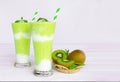 Kiwi smoothies colorful fruit juice beverage green healthy the taste yummy In glass drink episode morning on white background. Royalty Free Stock Photo