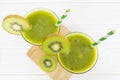 Kiwi yogurt smoothies juice and kiwi green fruit for breakfast in the morning on white background from top view Royalty Free Stock Photo