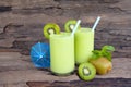 Kiwi yogurt smoothies juice and kiwi green fruit for breakfast in the morning on wood background.