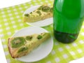 Kiwi tasty cake close up at plate and champagne bottle Royalty Free Stock Photo