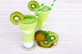 Kiwi Yogurt Healthy Fruit Smoothie Drink in the morning on a white wood background. Royalty Free Stock Photo
