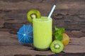 Kiwi yogurt smoothies juice and kiwi green fruit for breakfast in the morning on wood background.