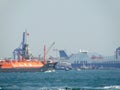 Kiz Kulesi famous Instanbul Tower Island - Tower, turkish flag, boats and harbour Crane