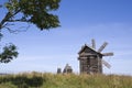 Kizhi. A windmill and Preobrazhenskiy church Royalty Free Stock Photo