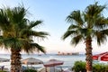 Kizkalesi castle on a small island, Kizkalesi Maiden`s Castle near Mersin, Turkey with palm trees