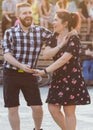 Kizomba, bachata or salsa concept - couple dancing social dance on open air party.