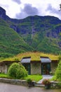 Kjelfossen waterfalls grass roof house Gudvangen Norway