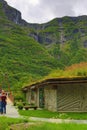 Kjelfossen waterfalls grass roof house Gudvangen Norway