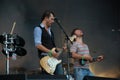 Klaas Janzoons and Tom Barman singing and playing live with the Deus band at Pohoda Festival, Trencin, Slovakia - July 8, 2011