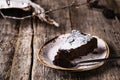 Kladdkaka. Traditional Swedish moist chocolate cake on old rustic wooden table