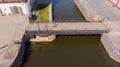 Klaipeda, Lithuania - april 26 2020: An old pedestrian bridge that rotates and allows small boats and yachts to enter the port