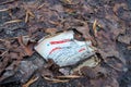 Klaipeda, Lithuania - december 18 2019: Paper coffe cup of Hesburger droped in the forest.