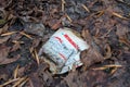 Klaipeda, Lithuania - december 18 2019: Paper coffe cup of Hesburger droped in the forest.