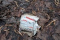 Klaipeda, Lithuania - december 18 2019: Paper coffe cup of Hesburger droped in the forest.