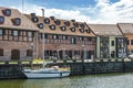 Klaipeda, Lithuania - Juny 24, 2021: Beautiful view on tourist boat, Dane river, embankment and red brick houses Klaipeda, Lithuan