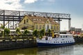 Klaipeda, Lithuania - Juny 24, 2021: Beautiful view on tourist boat, Dane river, embankment and yellow brick houses Klaipeda, Lith Royalty Free Stock Photo