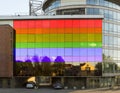 Klaipeda, Lithuania. May 2018: Reflection of old architecture Houses in a modern house with a glass facade, painted in the color o