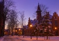 Klaipeda, Lithuania - 01 15 21: Old historical Neo-Gothic University building campus in winter snow, pink sunset colors and city