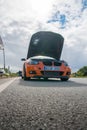 Klaipeda, Lithuania - september 04 2021: The BMW car stands on the parking lot with the hood open after the drag race.