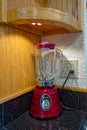 Klamath Falls, Oregon, USA - October 26, 2023: A red Osterizer 4126 Contemporary Classic Beehive Blender on a kitchen countertop