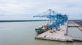 Klang, Malaysia - October 09, 2022: Cranes at the port Klang near Kuala Lumpur. Container crane at Klang Harbor. Aerial view on a