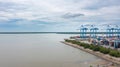 Klang, Malaysia - October 09, 2022: Cranes at the port Klang near Kuala Lumpur. Container crane at Klang Harbor. Aerial view on a