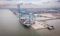 Klang, Malaysia - September 25, 2022: Cranes at the port Klang near Kuala Lumpur. Container crane at Klang Harbor. Aerial view on