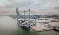 Klang, Malaysia - September 25, 2022: Cranes at the port Klang near Kuala Lumpur. Container crane at Klang Harbor. Aerial view on Royalty Free Stock Photo