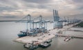 Klang, Malaysia - September 25, 2022: Cranes at the port Klang near Kuala Lumpur. Container crane at Klang Harbor. Aerial view on