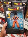 KLANG, MALAYSIA - 29 September 2020 : Hand hold a boxed set of Dragon Ball Mystic Gohan Toy in the supermarket.