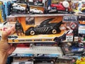 Klang, Malaysia - 29 September 2020 : Hand hold a boxed set for sell Batman Forever toys in the supermarket.