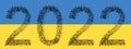 KLarge community of people forming the image of 2022 year on Ukrainian flag Royalty Free Stock Photo