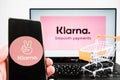 Klarna smooth payments logo on laptop and klarna company app logo on mobile phone.