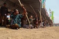 Klaten, Indonesia, august 15, 2023. male and female participants, dressed in Javanese custom pulled his bow by squinting to