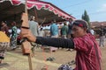 Klaten, Indonesia, august 15, 2023. male and female participants, dressed in Javanese custom pulled his bow by squinting to