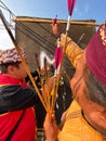 Klaten, Indonesia, august 15, 2023. male and female participants, dressed in Javanese custom pulled his bow by squinting to