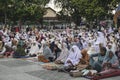 Klaten, Indonesia - June 29 2023: A photo of Muslim congregation praying Eid al-Adha in the field