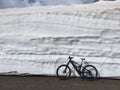 Klausenpass, Uri, Switzerland, bike in snow Royalty Free Stock Photo