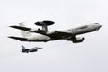 KLEINE BROGEL, BELGIUM - SEP 13, 2014: NATO Boeing E-3 Sentry AWACS radar plane in formation fligh with a Belgian Air Force F-18 Royalty Free Stock Photo