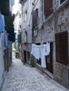 A narrow stone-paved alley. Royalty Free Stock Photo