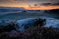 Kleiner Winterberg, beautiful morning view over sandstone cliff into deep misty valley in Saxony Switzerland, landscape in Germany