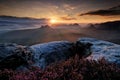 Kleiner Winterberg, beautiful morning view over sandstone cliff into deep misty valley in Saxony Switzerland, landscape in Germany