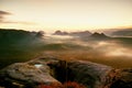 Kleiner Winterberg view. Fantastic dreamy sunrise on the top of the rocky mountain with the view into misty valley Royalty Free Stock Photo