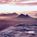 Kleiner Winterberg view. Fantastic dreamy sunrise on the top of the rocky mountain with the view into misty valley Royalty Free Stock Photo