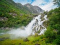 Kleivafossen waterfalls and mountains near briksdalsbreen Glacier in Norway Royalty Free Stock Photo