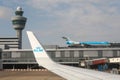 KLM airline hub at Schiphol Amsterdam airport. Airplane wing flight control tower and rooftop aviation museum Royalty Free Stock Photo