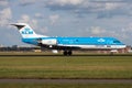 KLM Fokker 70 PH-WXC passenger plane landing at Amsterdam Schipol Airport Royalty Free Stock Photo