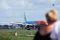 KLM Orange livery plane. Spotters watching it taking off from Amsterdam Airport Schiphol, AMS