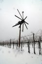 Klopotec scarecrow in austrian vineyard in winter Royalty Free Stock Photo